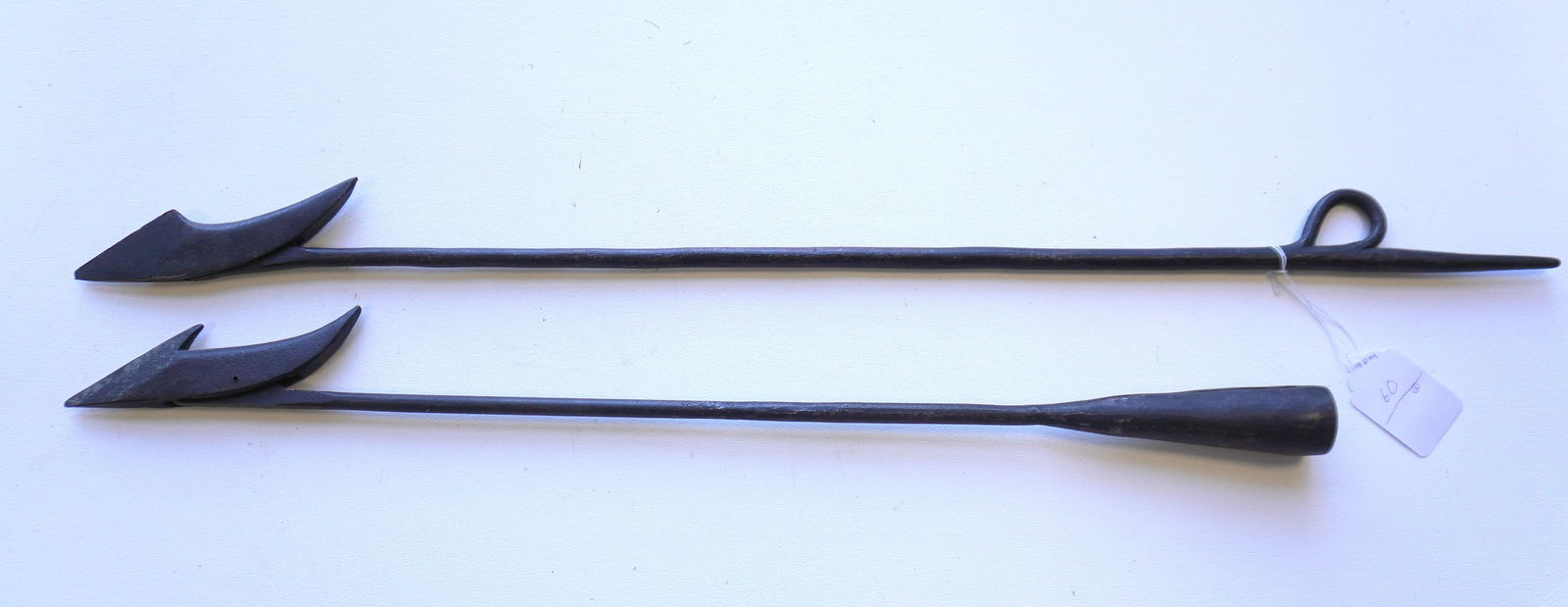 Two iron whaling harpoons, both with hand forged iron shafts and wrought iron head, probably late: Two iron whaling harpoons, both with hand forged iron shafts and wrought iron head, probably late 19th to early 20th century. The largest measures 36 1/2"L. Provenance: From the estate of Jeff Raymond