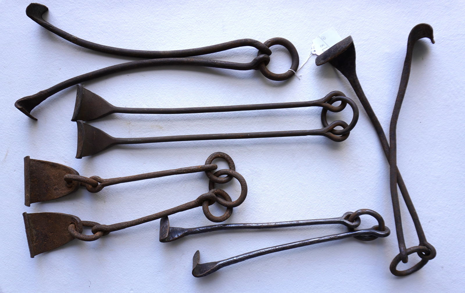 Grouping of 5 early 19th century cask lifters, all appear to be hand forged iron and in good: Grouping of 5 early 19th century cask lifters, all appear to be hand forged iron and in good condition. The largest measures 25"L. Provenance: From the estate of Jeff Raymond, Red Hook NY.