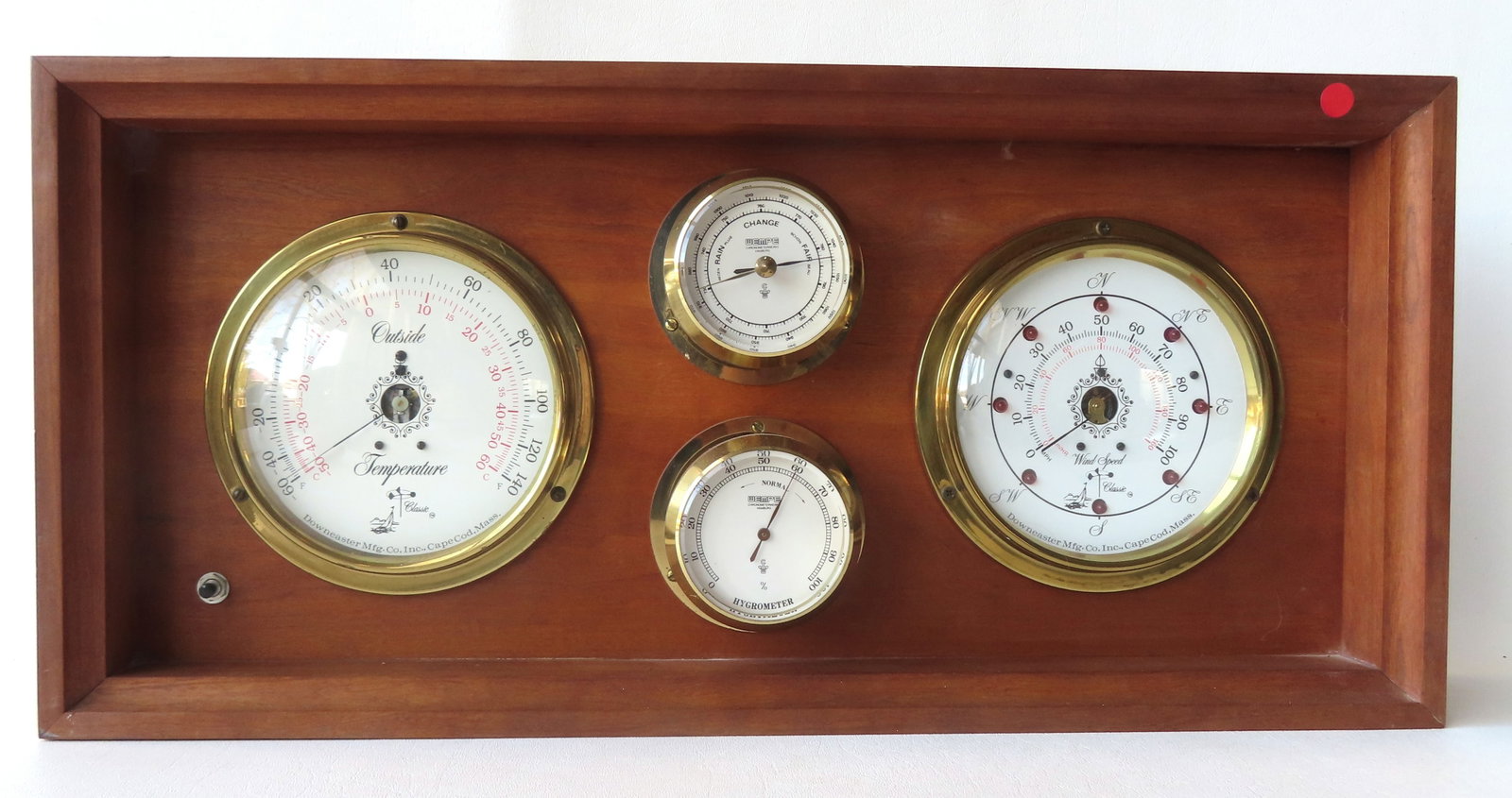 Grouping of contemporary Downeaster Mfg. Co. gauges, mounted within a wooden display. Includes: Grouping of contemporary Downeaster Mfg. Co. gauges, mounted within a wooden display. Includes temperature, wind speed, barometer, and hygrometer - note the electrical leads on revere side, but has no
