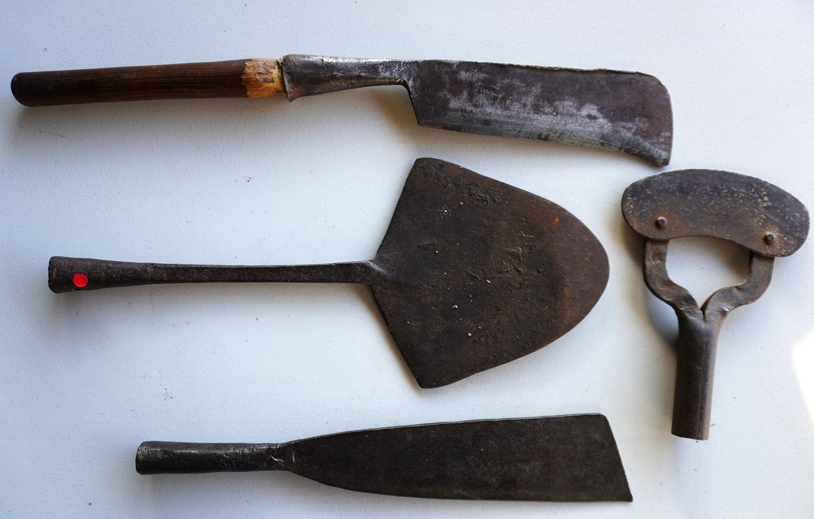 Grouping of 4 hand forged iron blubber flensing tools, 18th/19th century, one signed "G.B. Hilger",: Grouping of 4 hand forged iron blubber flensing tools, 18th/19th century, one signed "G.B. Hilger", probably the 18th century blacksmith who forged it. The largest measures 25 1/4"L x 9"W. Provenance: