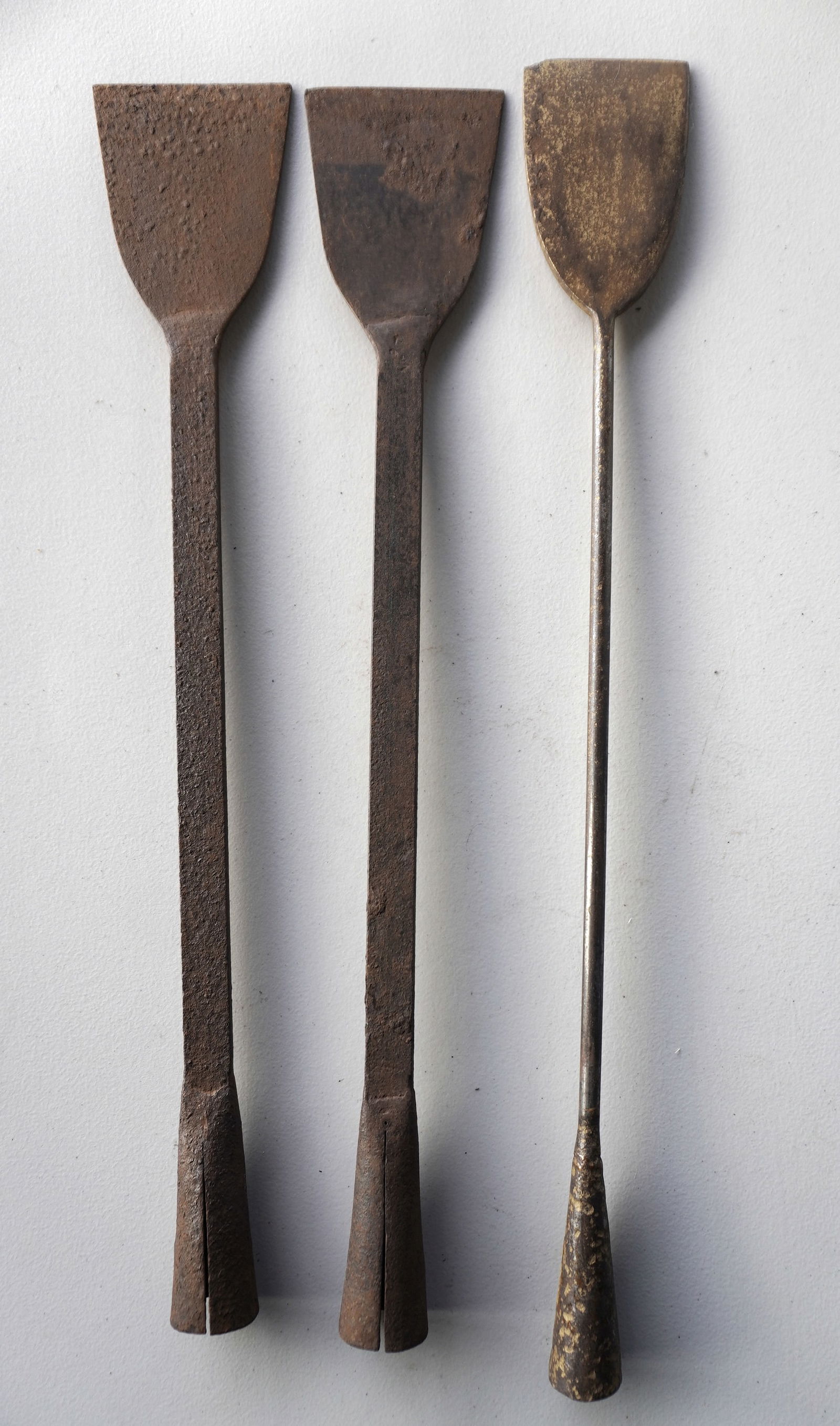 Grouping of 3 wrought iron flensing spades with long iron shafts, early to mid 19th century in good: Grouping of 3 wrought iron flensing spades with long iron shafts, early to mid 19th century in good condition. The largest 27"L x 4 1/2"W. Provenance: From the estate of Jeff Raymond, Red Hook NY.