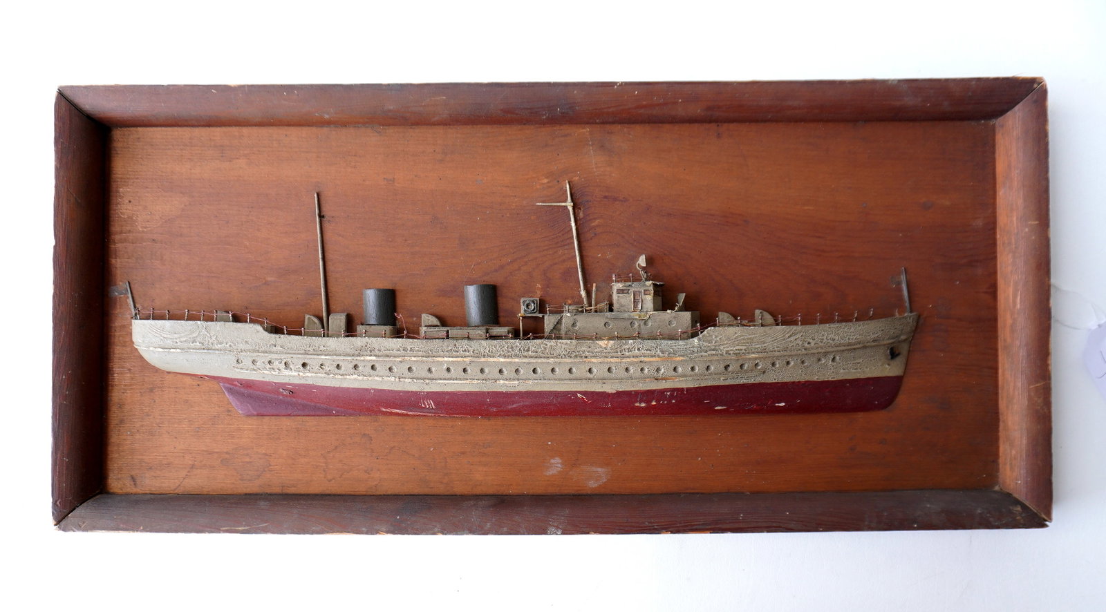 A half ship model of a merchant steam ship in original paint, early 20th century, good condition.: A half ship model of a merchant steam ship in original paint, early 20th century, good condition. Measures 26"W x 12"H x 3"D. Provenance: From the estate of Jeff Raymond, Red Hook NY.