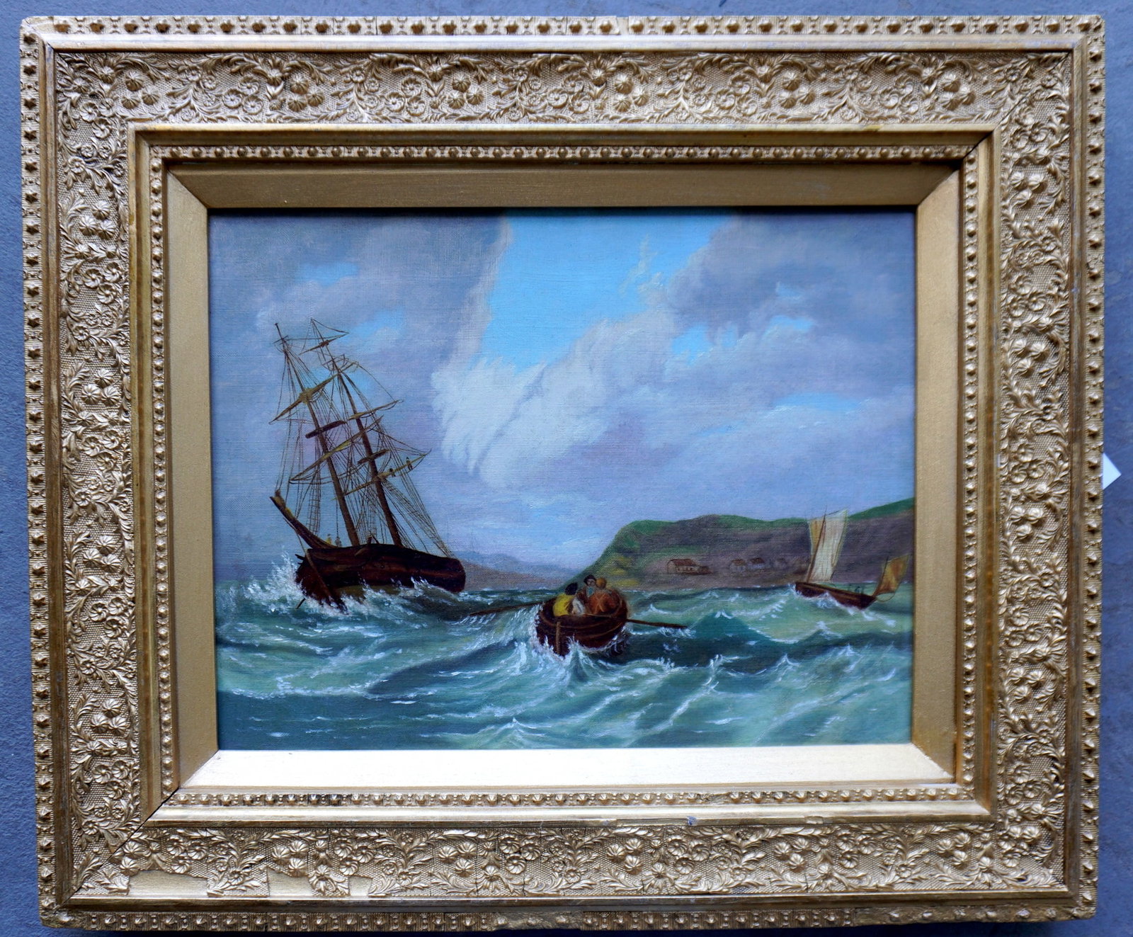 O/C Seascape depicting fisherman in skiff in foreground and fishing schooner in background, housed: O/C Seascape depicting fisherman in skiff in foreground and fishing schooner in background, housed in original frame, circa 1860-70. The gilt gesso frame with minor losses and has been reguilded. The 