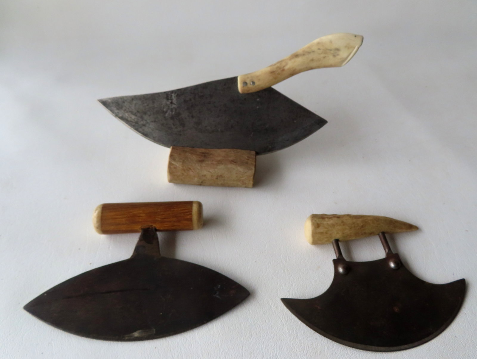 Three food choppers, all with newer horn and bone handles. The blades likely late 19th to early 20th: Three food choppers, all with newer horn and bone handles. The blades likely late 19th to early 20th century and handles later in 20th century. The mounted tool with paper label attached indicating Al
