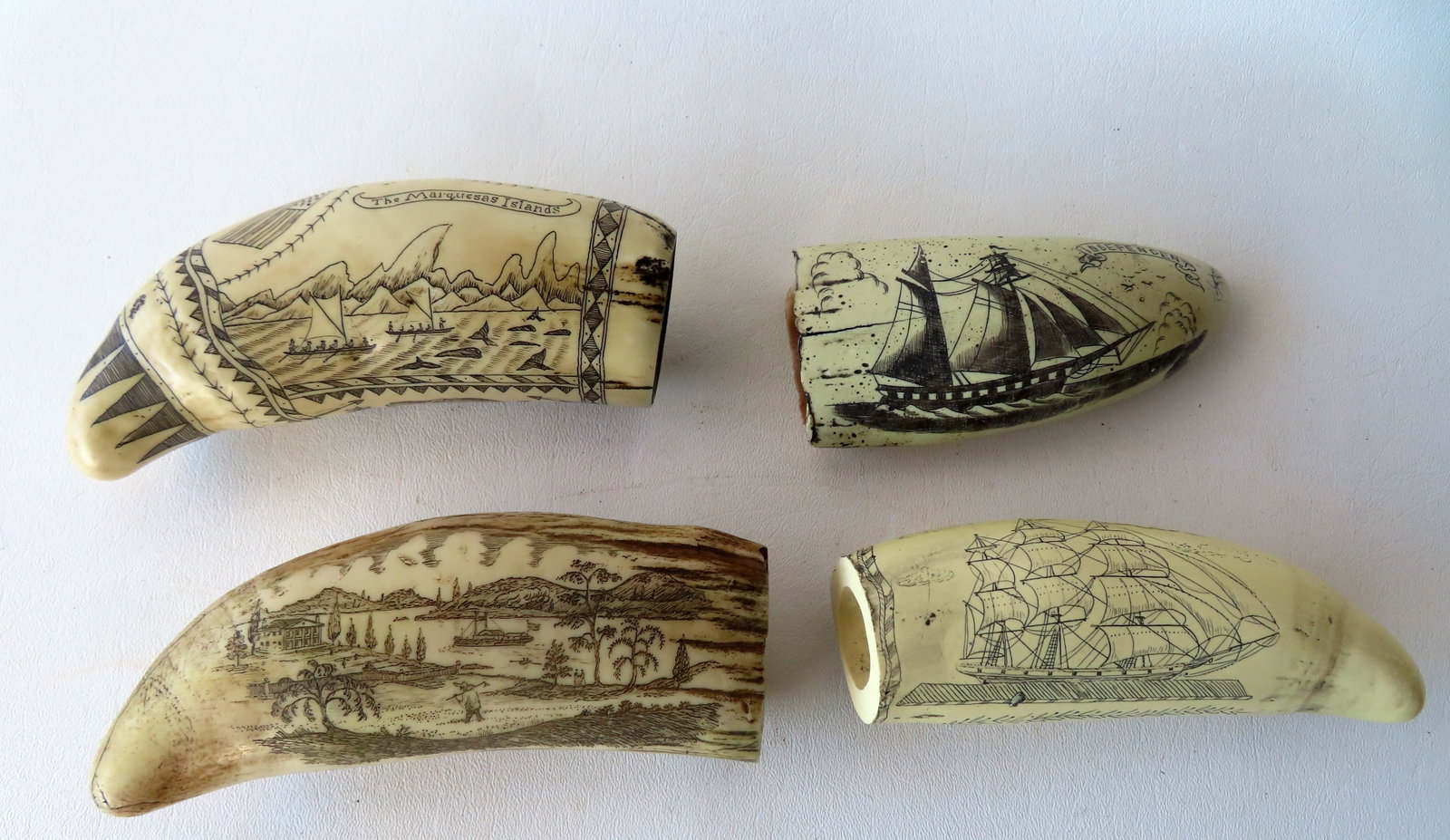 Grouping of 4 reproduction resin scrimshaw whale teeth, one signed A.T. Moger depicting sailing ship: Grouping of 4 reproduction resin scrimshaw whale teeth, one signed A.T. Moger depicting sailing ship and Lady Liberty waving American flag. All in very good condition. The largest measures 6 1/4"L. Pr