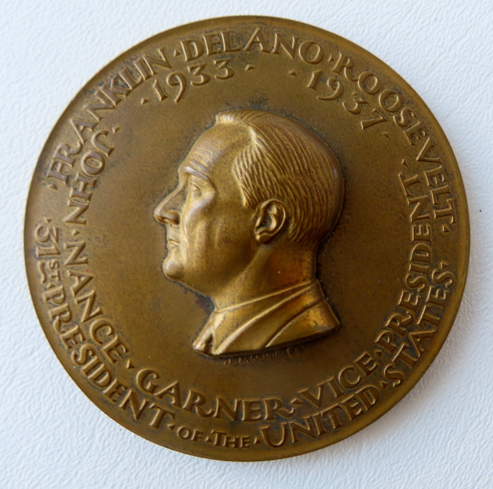 A 1933 Franklin Roosevelt official Bronze inaugural medal for his first term in office, with John: A 1933 Franklin Roosevelt official Bronze inaugural medal for his first term in office, with John Nance Gardner as Vice-President, 1933-1937. These medallions where struck in a limited edition by the 