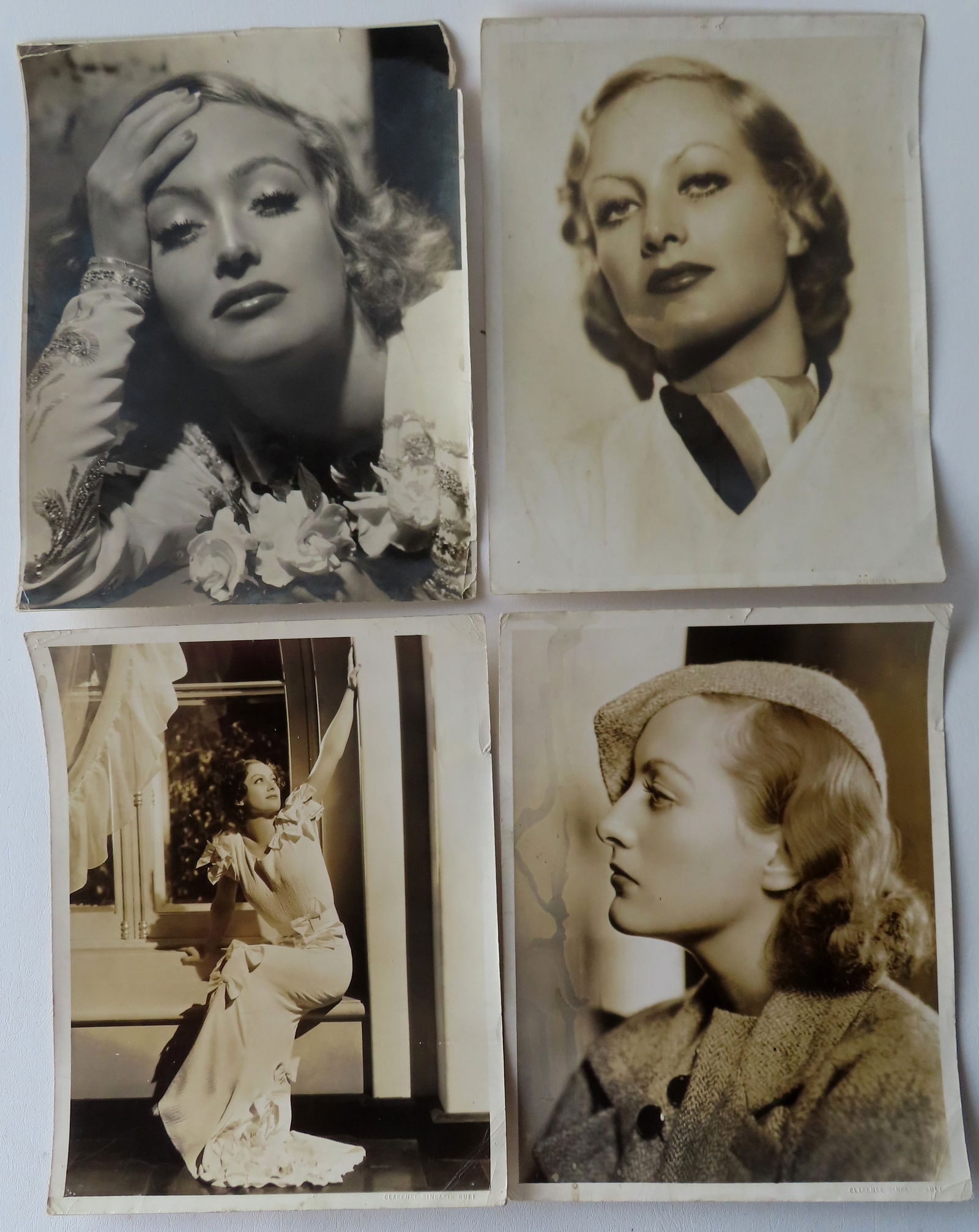 Four Joan Crawford glossy photos, 2 by Clarence Sinclair Bull (1895-1979 active in USA - Hollywood),: Four Joan Crawford glossy photos, 2 by Clarence Sinclair Bull (1895-1979 active in USA - Hollywood), 1 by Hurrell (George Hurrell 1904 - 1992 was active/lived in Illinois, California, Ohio.), and 1 wi