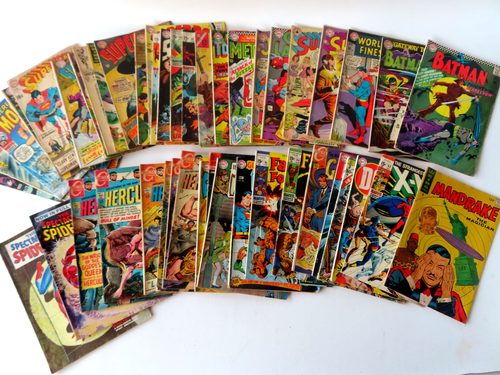 Grouping of 47 comics, most DC, Marvel, and Charlton Comics - 12c and 15c, with action figures: Grouping of 47 comics, most DC, Marvel, and Charlton Comics - 12c and 15c, with action figures including several Superman, several Superboy, Hercules No. 1-3-4-5-7-8-, Fantastic Four No. 94--95, Aquam