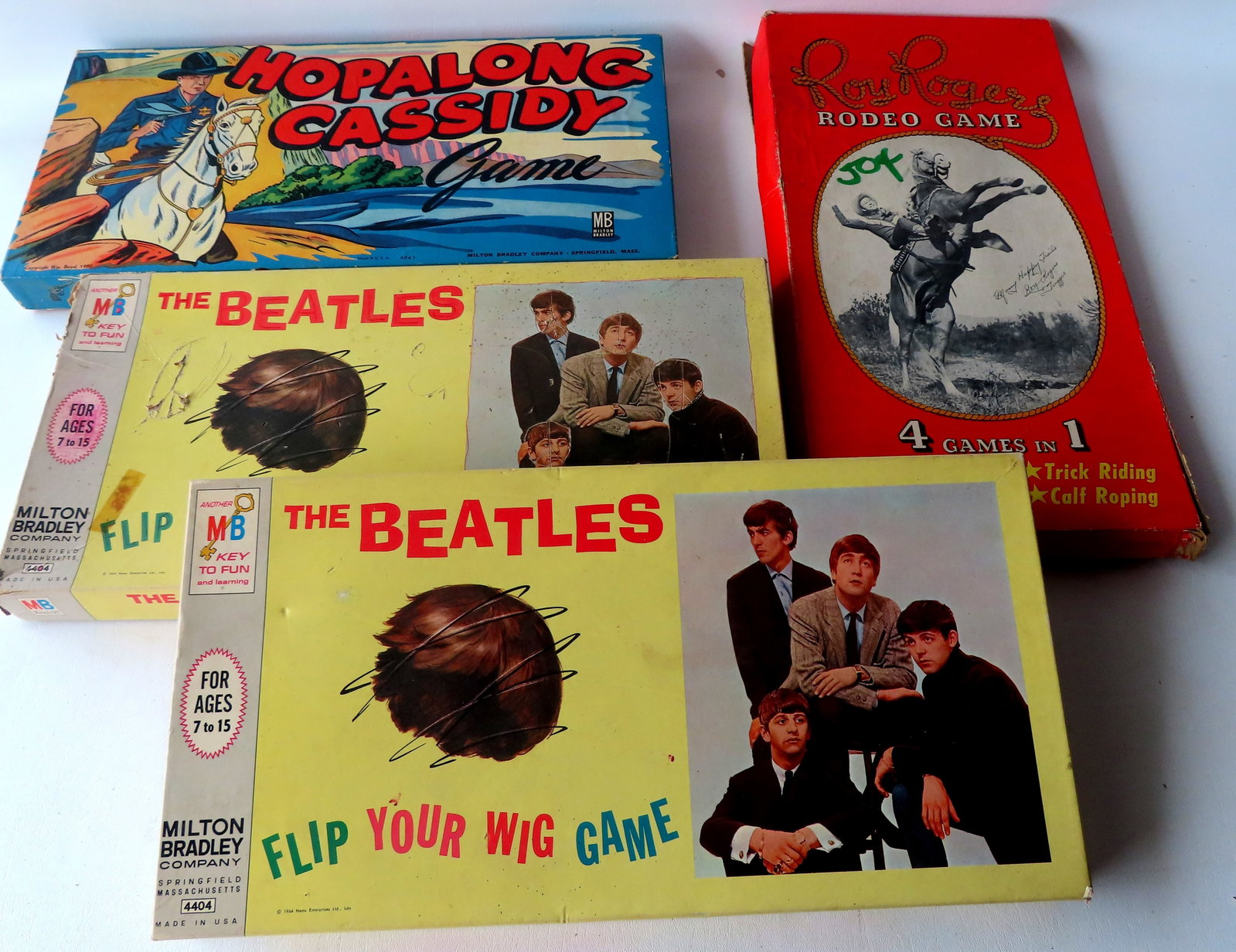 Grouping of 4 vintage board games including: Hopalong Cassidy by Milton Bradley 1950 - complete and: Grouping of 4 vintage board games including: Hopalong Cassidy by Milton Bradley 1950 - complete and in very good condition, likely unused - the box measures 7" x 9 3/4"; Roy Rogers Rodeo Game by Rogde