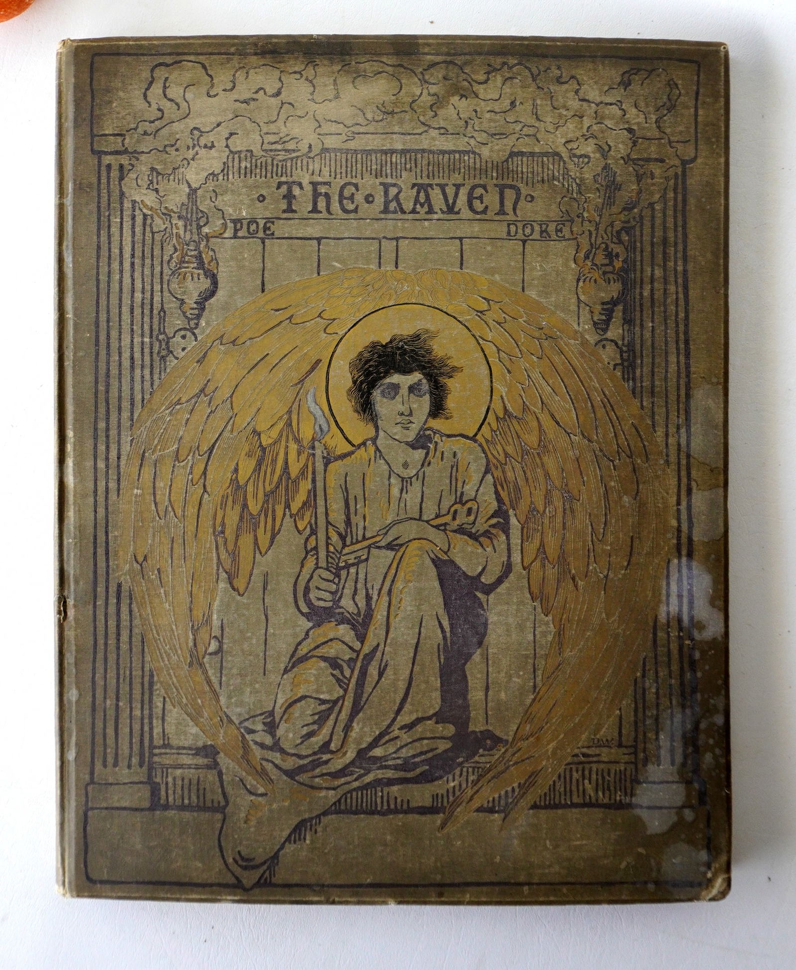 Book titled "The Raven" by Edgar Allan Poe and illustrated by Gustave Dore. Published in NY by: Book titled "The Raven" by Edgar Allan Poe and illustrated by Gustave Dore. Published in NY by Harper & Brothers 1884. Some stains and use wear to covers most noticeable in corners, and the interior w