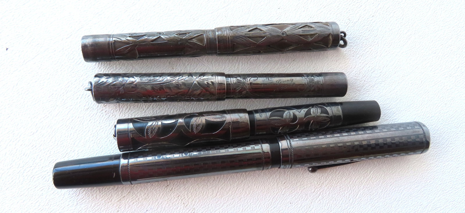 Grouping of 4 sterling silver fountain pens including Waterman's Ideal (this is the largest: Grouping of 4 sterling silver fountain pens including Waterman's Ideal (this is the largest measuring 5 7/8"L), 2 smaller Waterman's pens, 1 unmarked by maker but marked sterling. All in good conditio