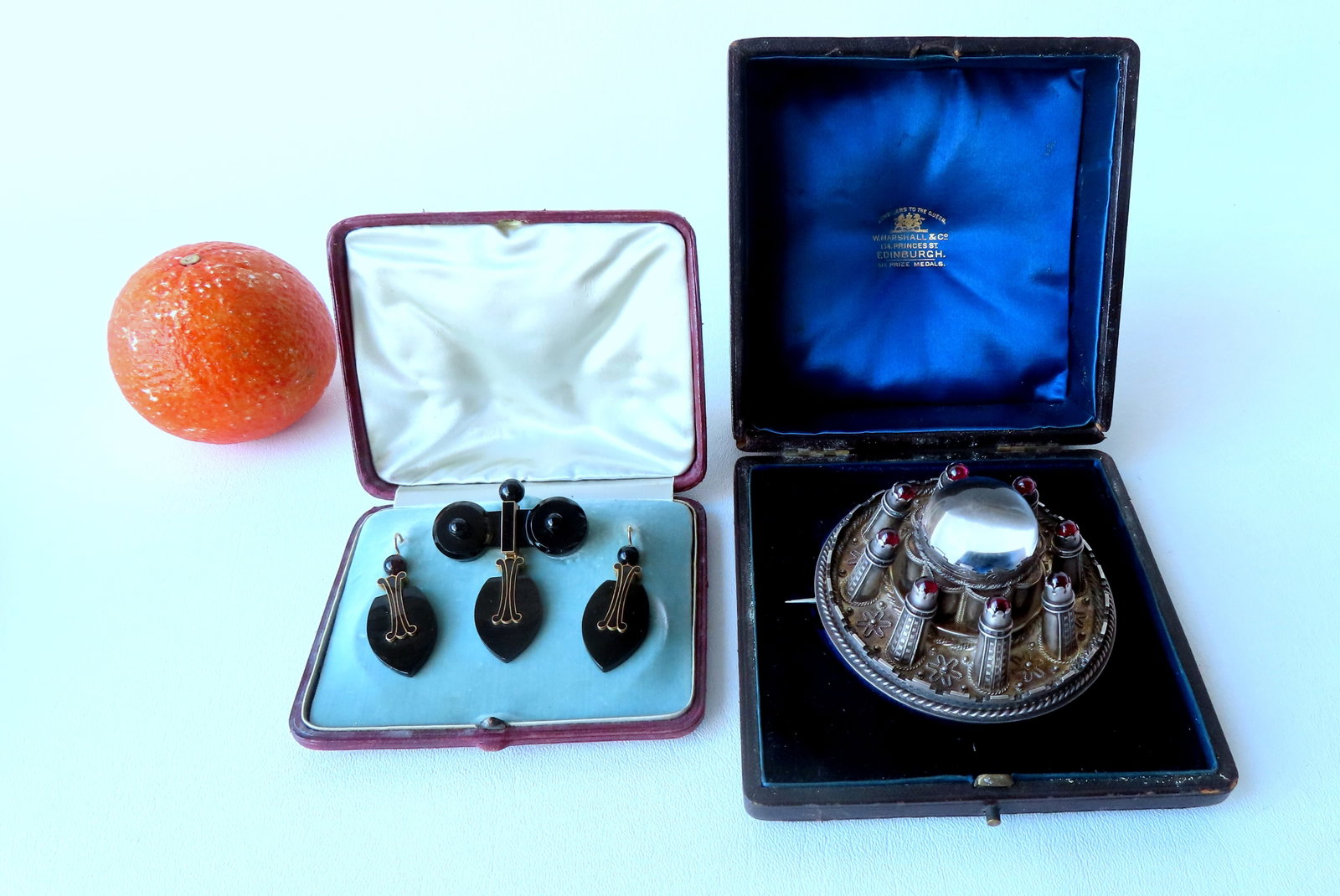 Two 19th century cased jewelry collectibles, 19th century. The first, an unusual large silver brooch: Two 19th century cased jewelry collectibles, 19th century. The first, an unusual large silver brooch or kilt pin, signed "W. Marshall / Edinburgh / Jewelers To The Queen" housed in original leather bo