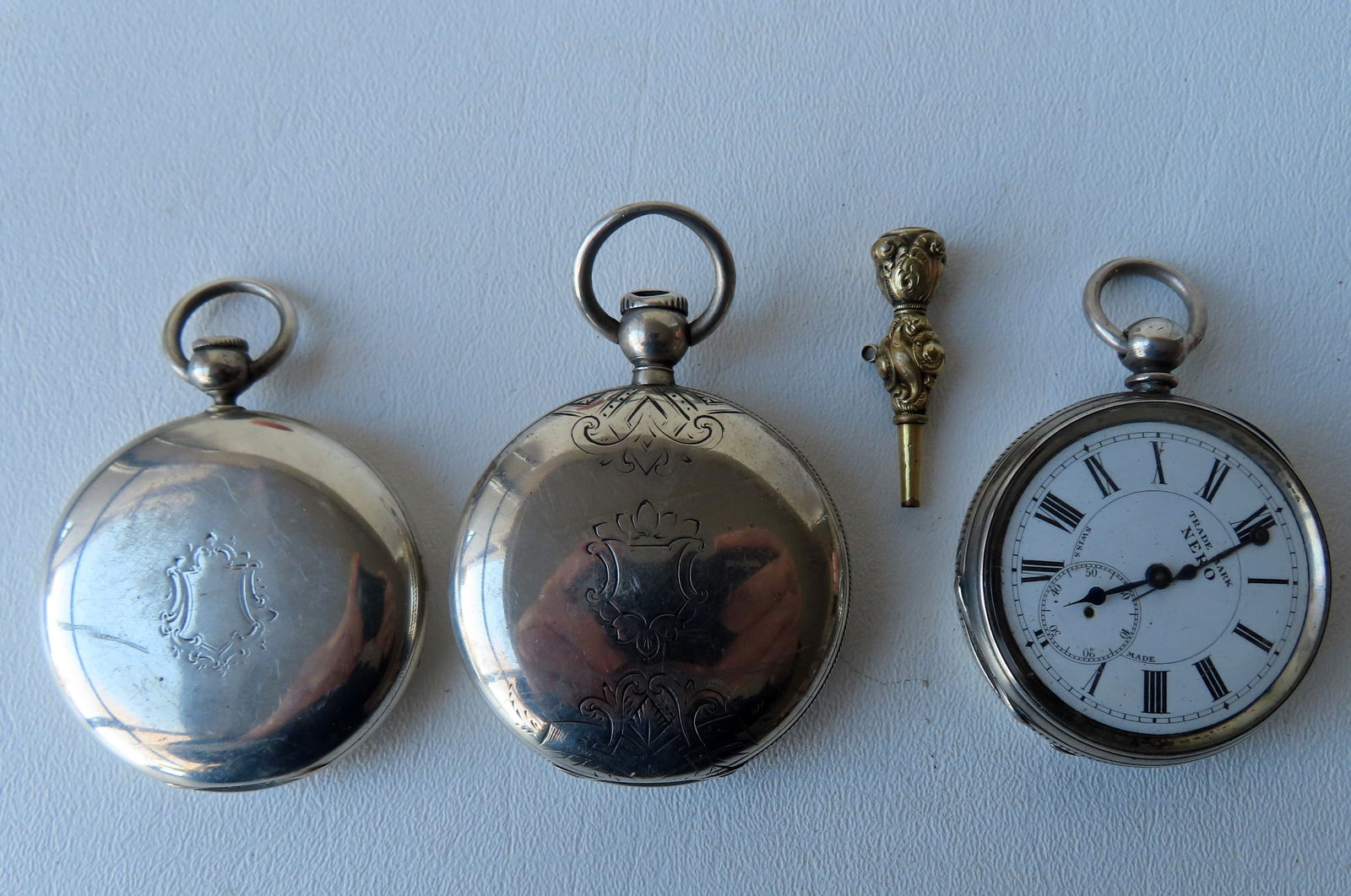 Three vintage pocket watches including: A Waltham key wind pocket watch with hunter case and second: Three vintage pocket watches including: A Waltham key wind pocket watch with hunter case and second hand and marked Warranted Coin Silver - runs for short time then stops, otherwise good condition - s