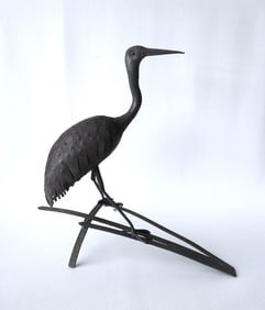 A standing Heron garden ornament in welded sheet tin, setting on wrought iron strap iron base - the