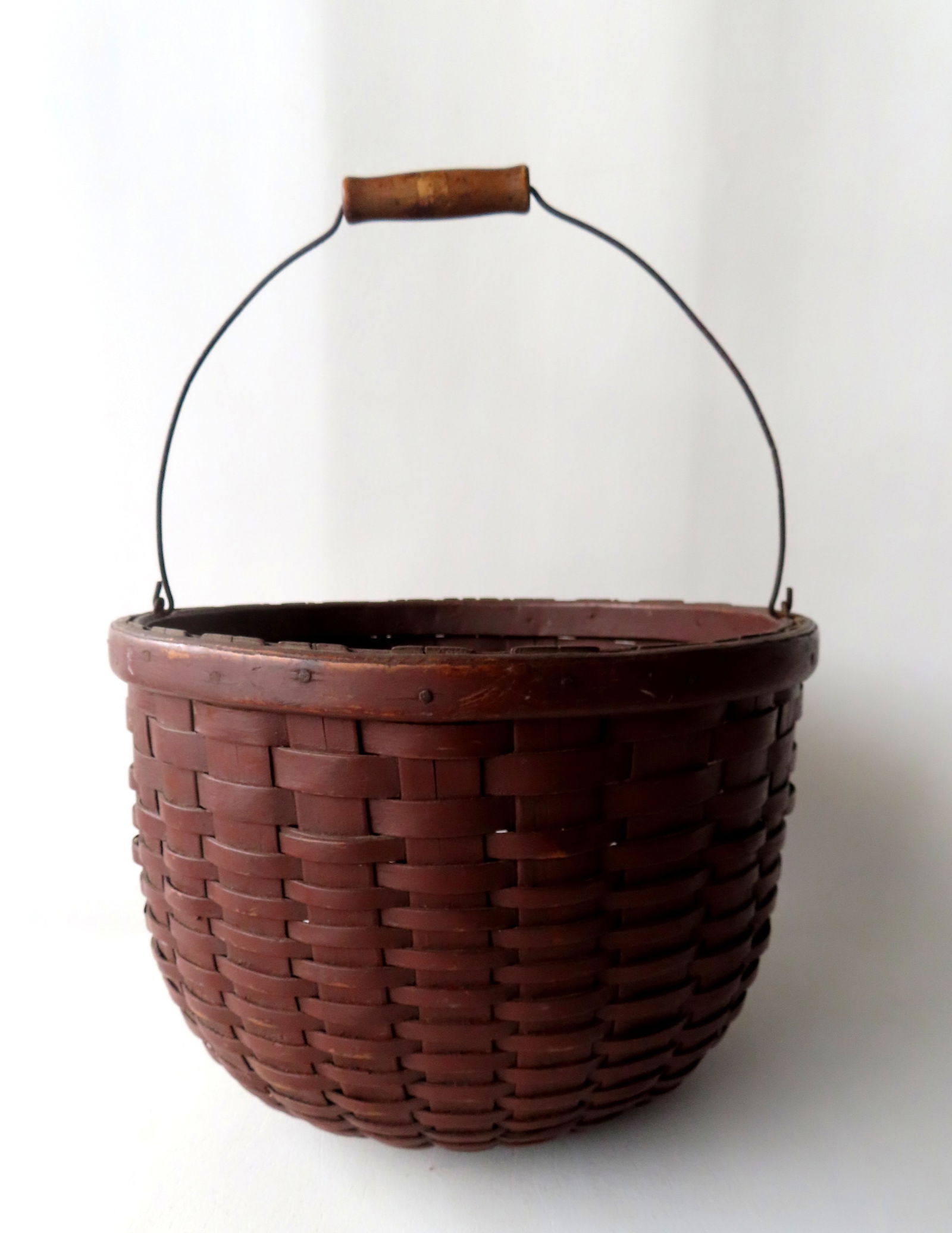 A splint wood apple basket with bale handle in original red paint, with a turned wooden base,  and (1 of 12)