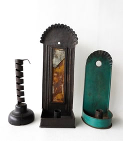 Three early lighting devices including 2 non-matching tin candle wall sconces (the mirror backing on