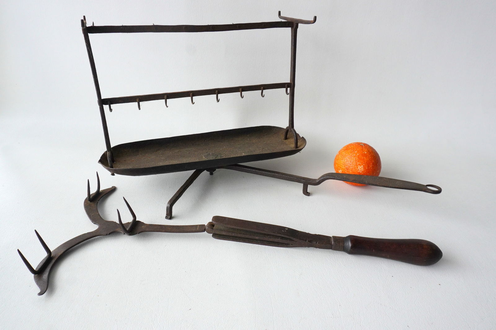 Two early hand forged roasters, 18th century, including: A rare long handled  footed and swivel bird (1 of 19)