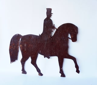 A folk art silhouette weathervane depicting a soldier on horseback, 19th century, traces of old