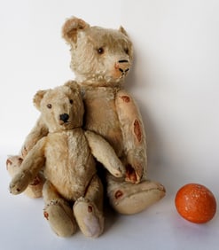 Two jointed Teddy Bears, probably Steiff but missing buttons. The first, a large mohair bear with
