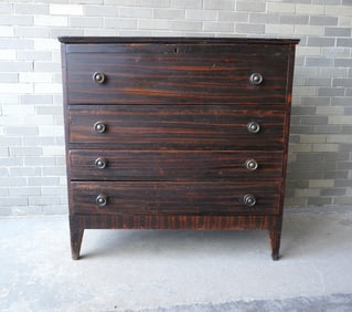 An early grain painted blanket chest having 2 false drawers over 2 dovetailed drawers mounted on