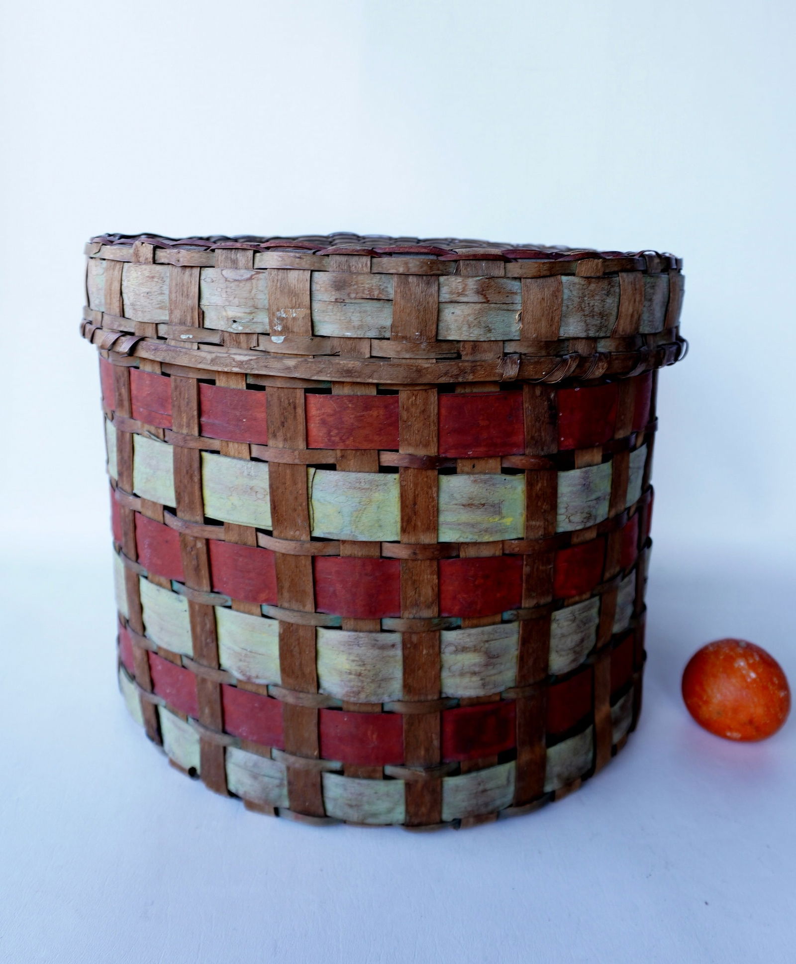 A colorful Native American covered basket with painted splints - traces of a newspaper lining on (1 of 13)