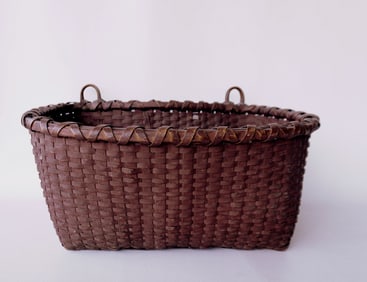 An apple picking basket in original grungy red paint, mid 19th century or earlier. Double loop