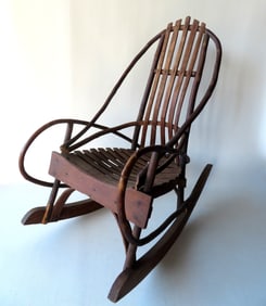 A child's Adirondack twig rocker with slatted seat and back, late 19th century in good original
