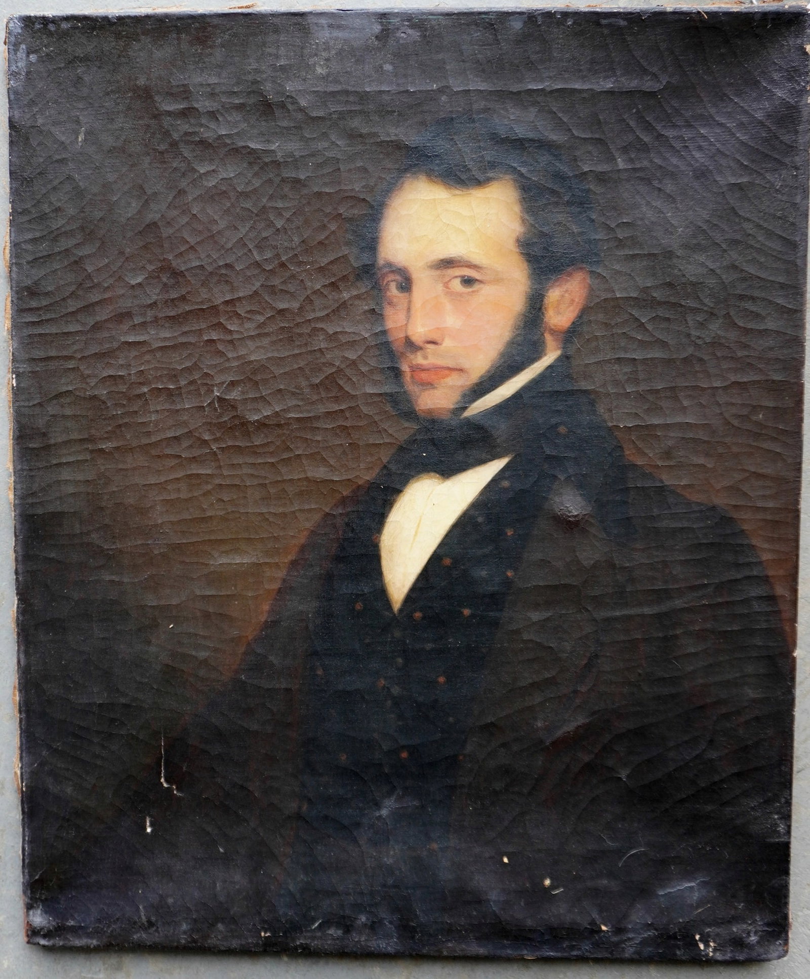 O/C unframed portrait of a scholarly looking gentleman wearing cloak over vest, 1830-50. Some: O/C unframed portrait of a scholarly looking gentleman wearing cloak over vest, 1830-50. Some crazing and taped repairs on reverse. Stenciled label on reverse marked illegibly (see photos). Measures 2