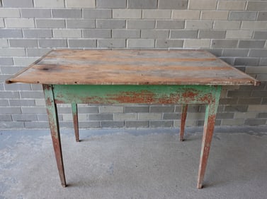 A primitive tapered leg tap table with scrubbed (use wear) top with original breadboard ends and