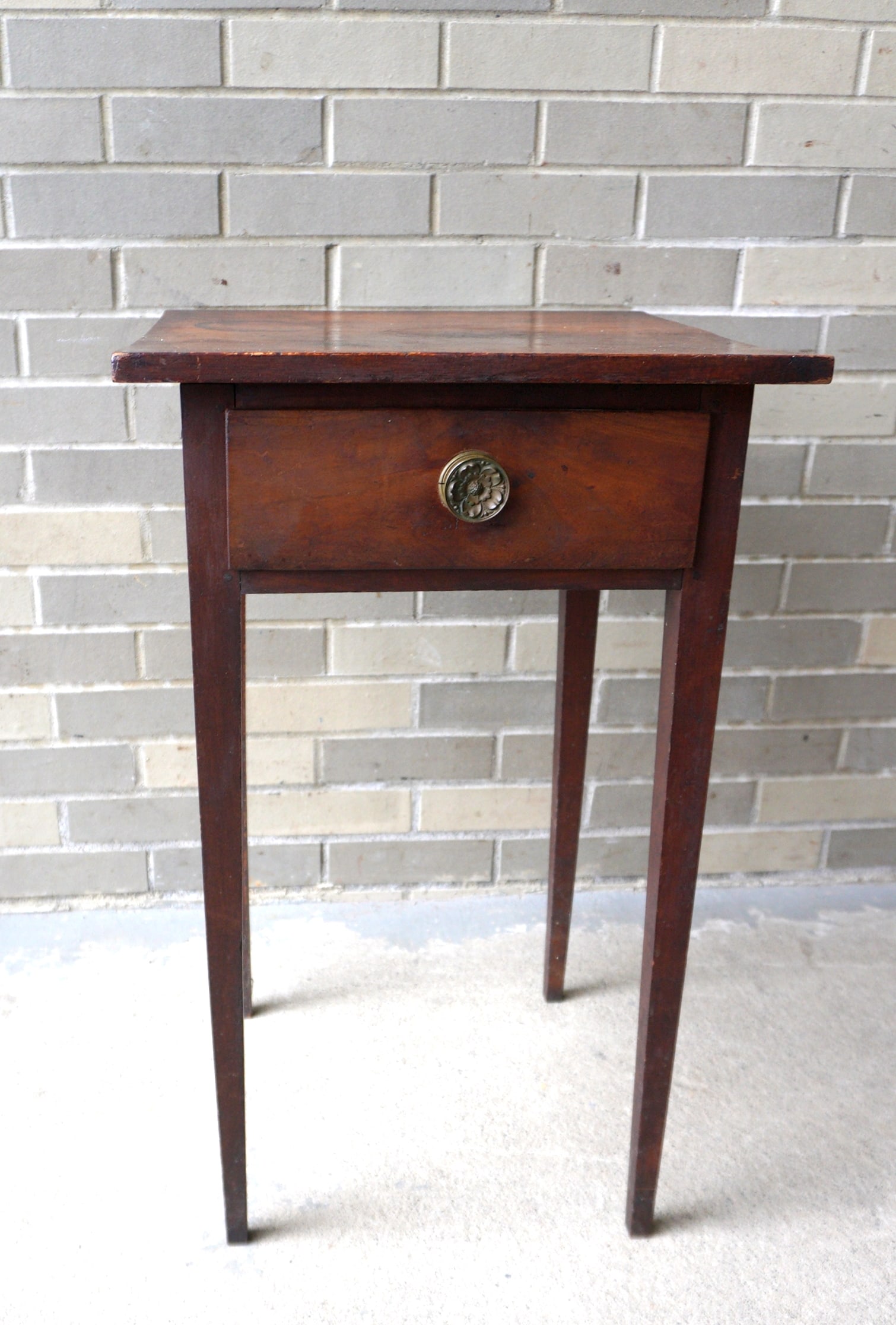 A Hepplewhie 1 drawer stand in birch wood, retaining original brass rosette drawer pull, circa 1810.: A Hepplewhie 1 drawer stand in birch wood, retaining original brass rosette drawer pull, circa 1810. Original finish and in good condition. Measures 17" square x 28"H. Provenance: From the Asa & Jean 