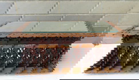 A curious lady's folk art dresser box with extensive floral fretwork around the lid and body, late