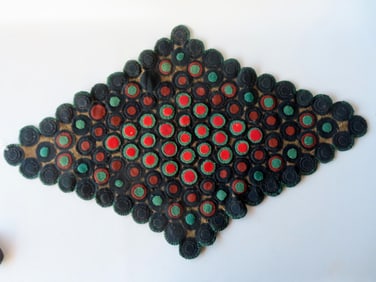 An early table penny rug, all hand sewn, constructed with concentric felt circles sewn to homespun