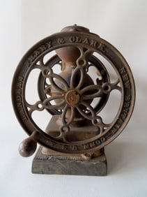 A cast iron double wheel coffee mill signed "Landers, Frary & Clark / New Britain Conn. U.S.A.",