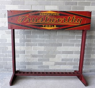 A colorful country store tool advertising display in lithographed sheet iron marked "Agricultural