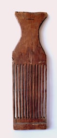 A primitive New England tape loom, early 19th century. The base may have been repaired in the 19th