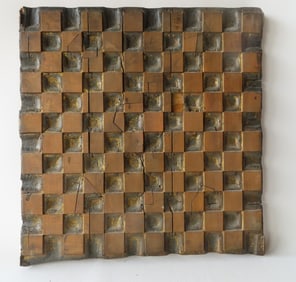 A unique primitive hand made wooden mold, or gameboard, with 144 squares, half of which are gouged