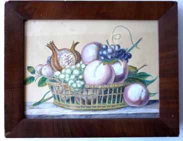 A theorem watercolor depicting a basket of fruit resting on table, 19th century. Housed in a mid