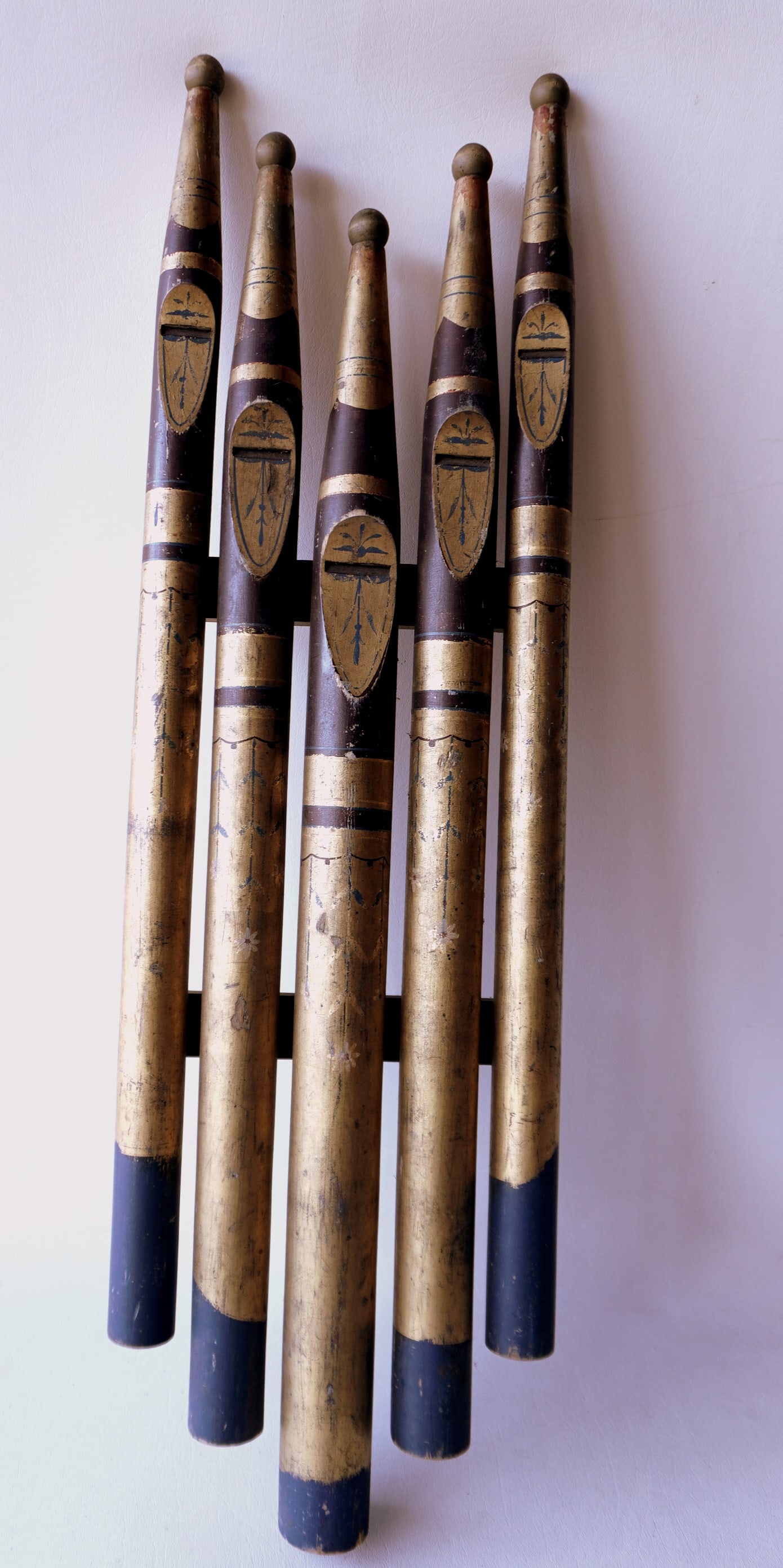 A grouping of 5 hand painted and carved wooden organ pipes, converted to a wall mounted folk art (1 of 5)
