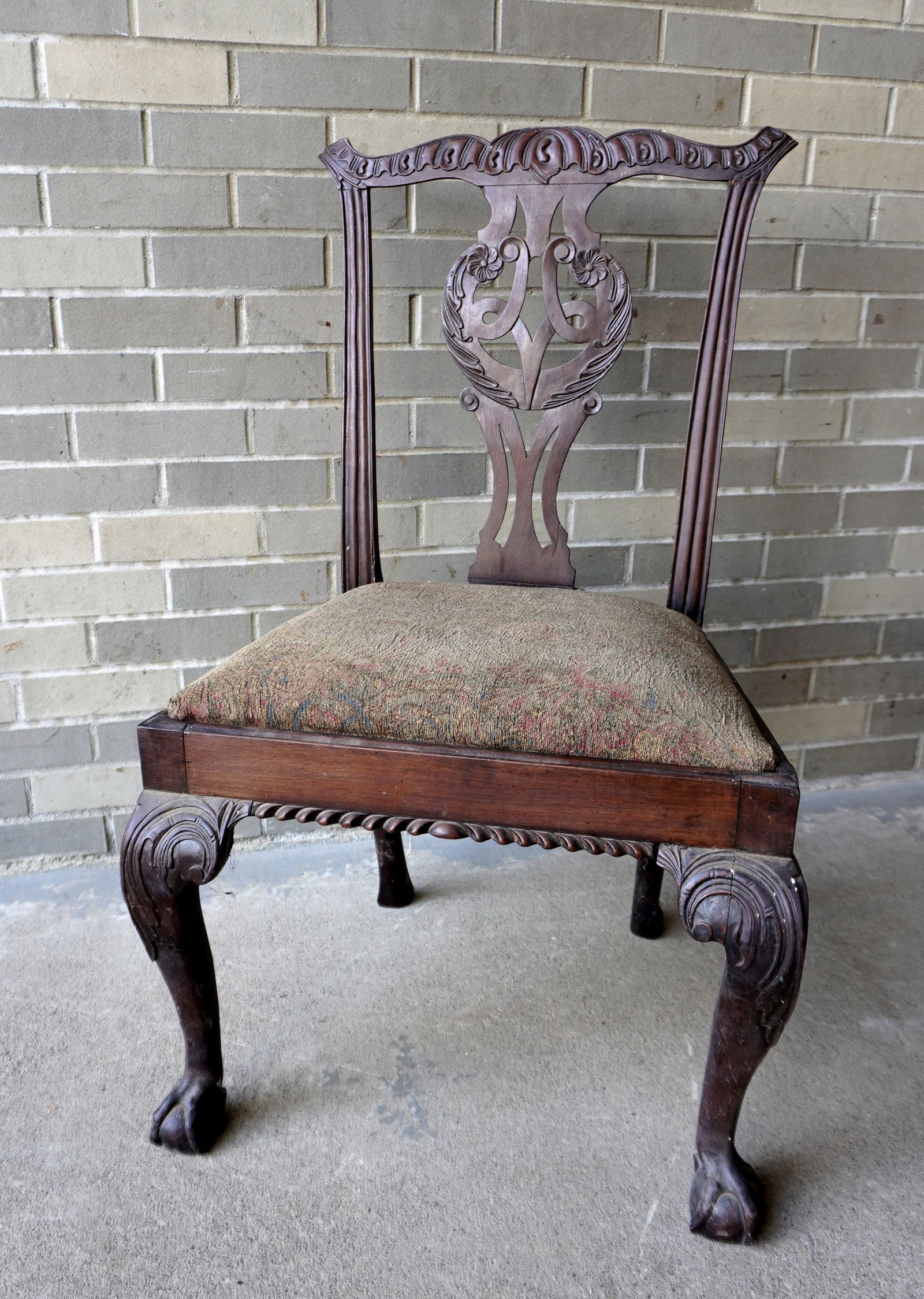 A mahogany Chippendale side chair with carved crest over mortised terminals and pierced center splat (1 of 20)