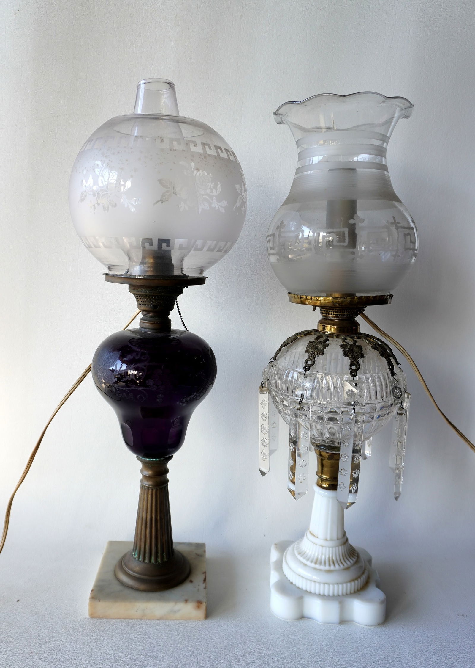A pair of fancy 19th century oil lamps, both 19th century. The first in cranberry cut to clear circa (1 of 14)
