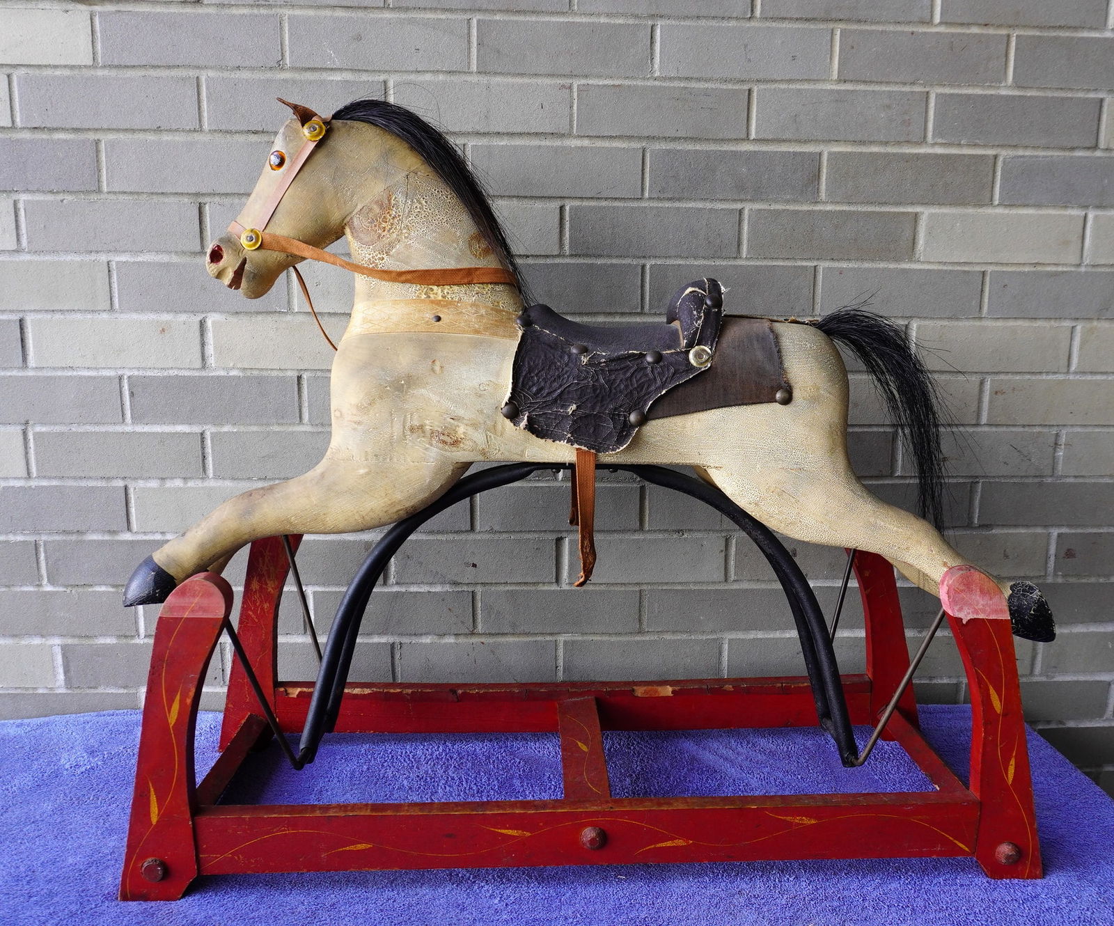 A dapple gray hobby horse in original paint, mounted on rocking platform in original red paint with (1 of 14)
