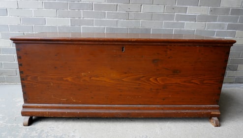 A Hudson Valley shoe-foot blanket box, circa 1800, in natural finish, iron handles, step molded