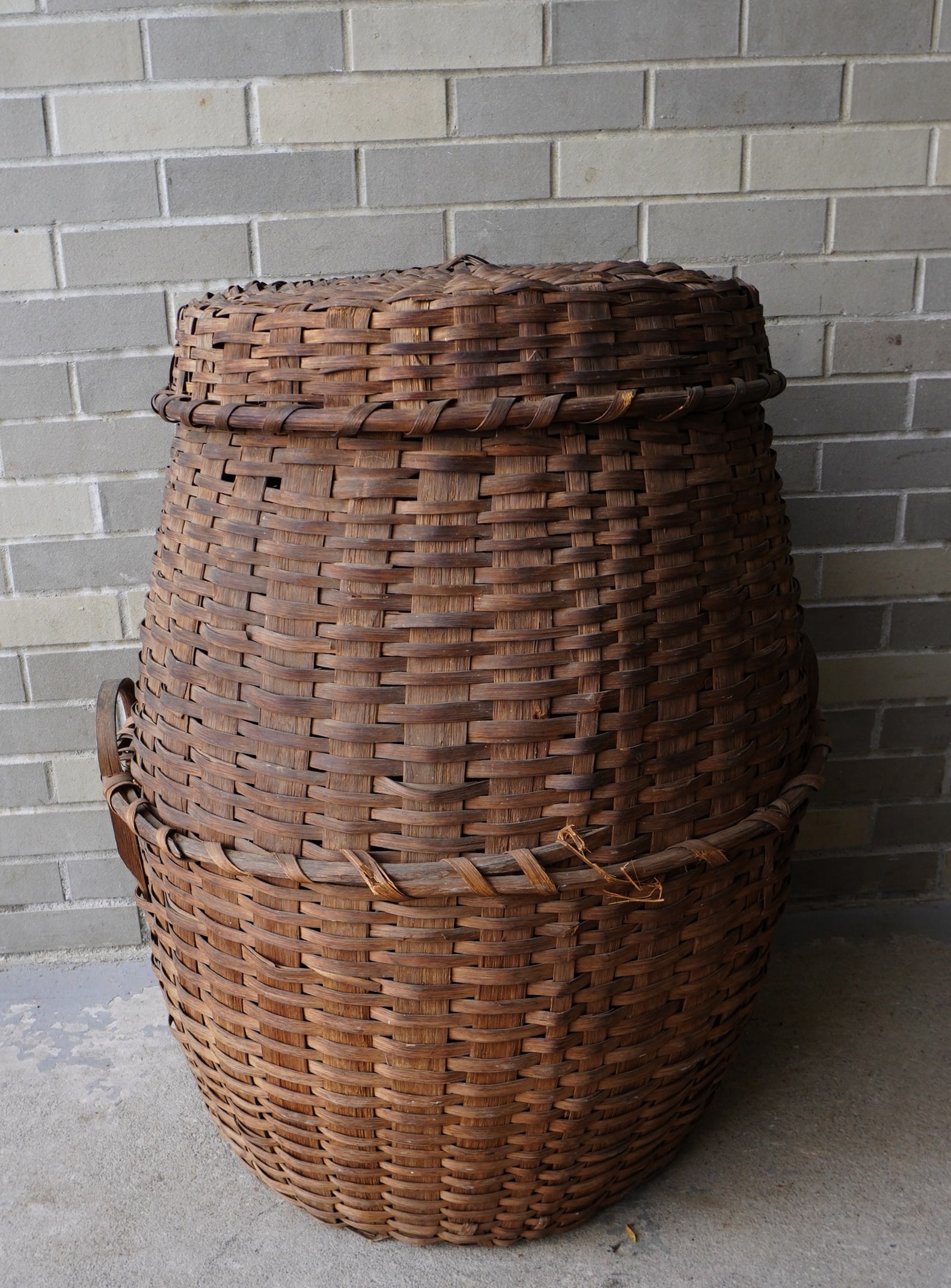 An unusually large covered feather basket with wooden handles applied to center horizontal woven (1 of 10)