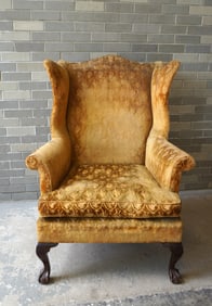A Chippendale style wing chair of fine proportions, down filled cushion, horse hair and cotton