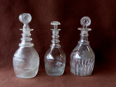 Three early blown decanters, 2 appear to have replaced stoppers, else good condition, 19th century.