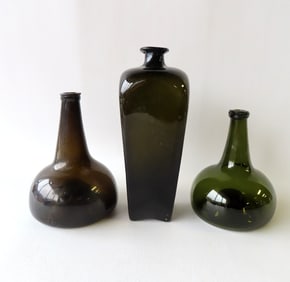 Three early bottles: A gin bottle in olive green, and 2 wine bottles with pushed up bottoms and
