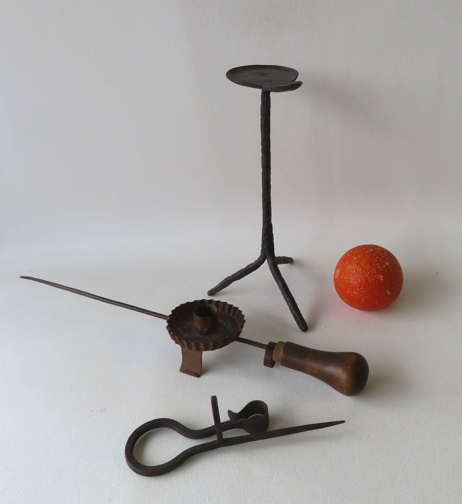 Three early metal lighting devices including: An adjustable long handled candle lighting device with (1 of 11)