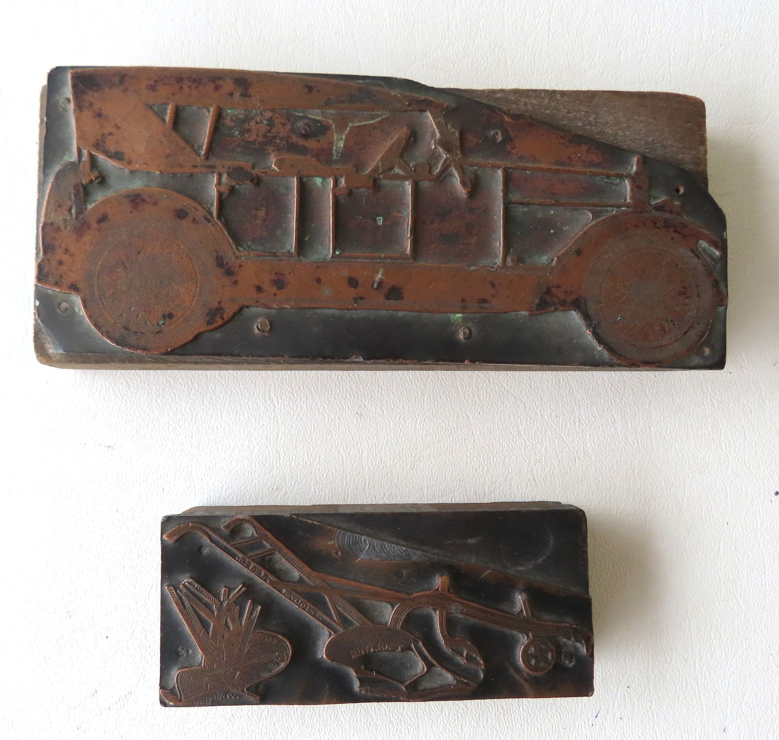 Two brass printing blocks, circa 1920-30, each attached to a wooden block. The first of an (1 of 10)