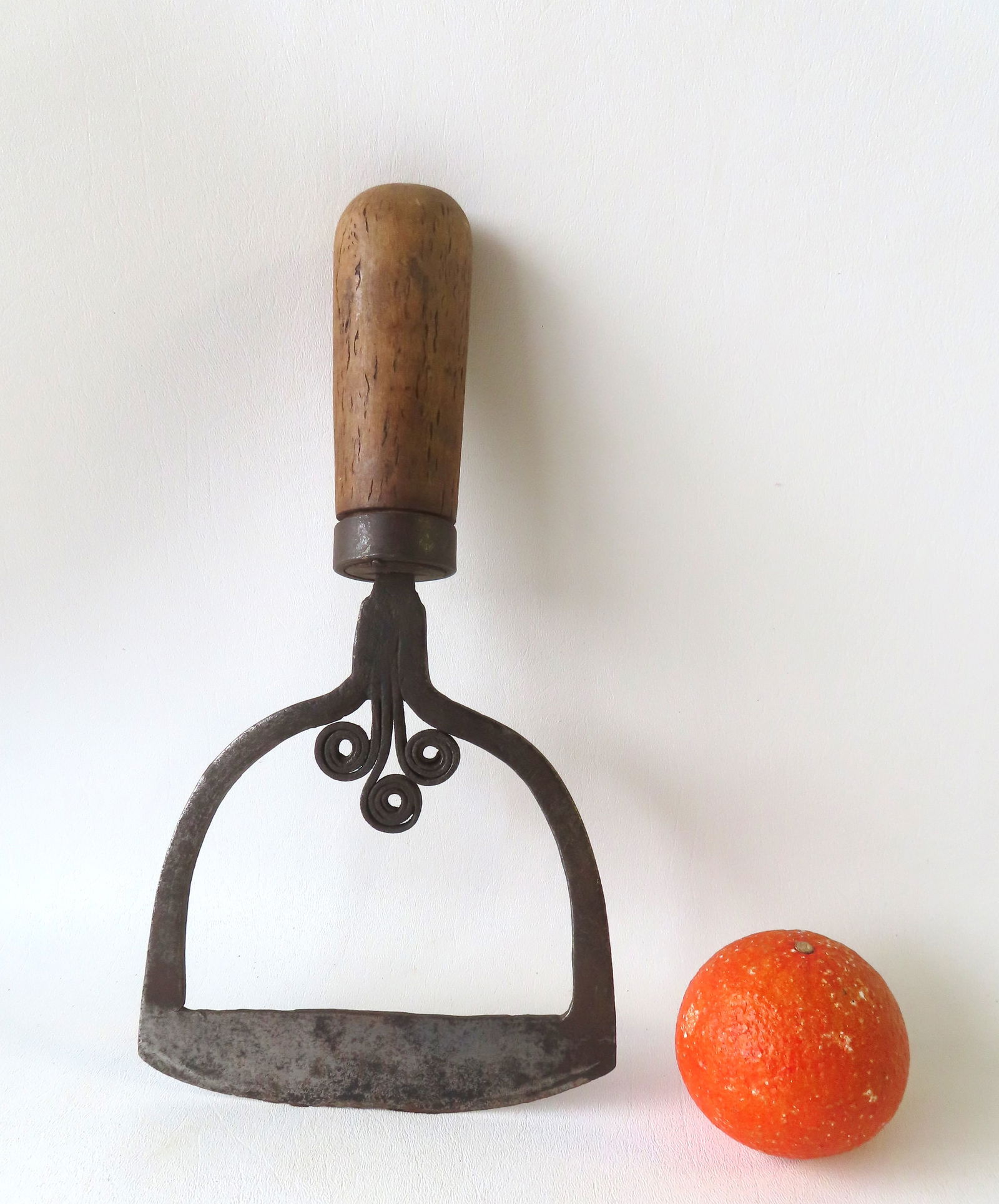 A very fine primitive hand forged iron food chopper with wooden handle. Note the scrolls at the base (1 of 5)