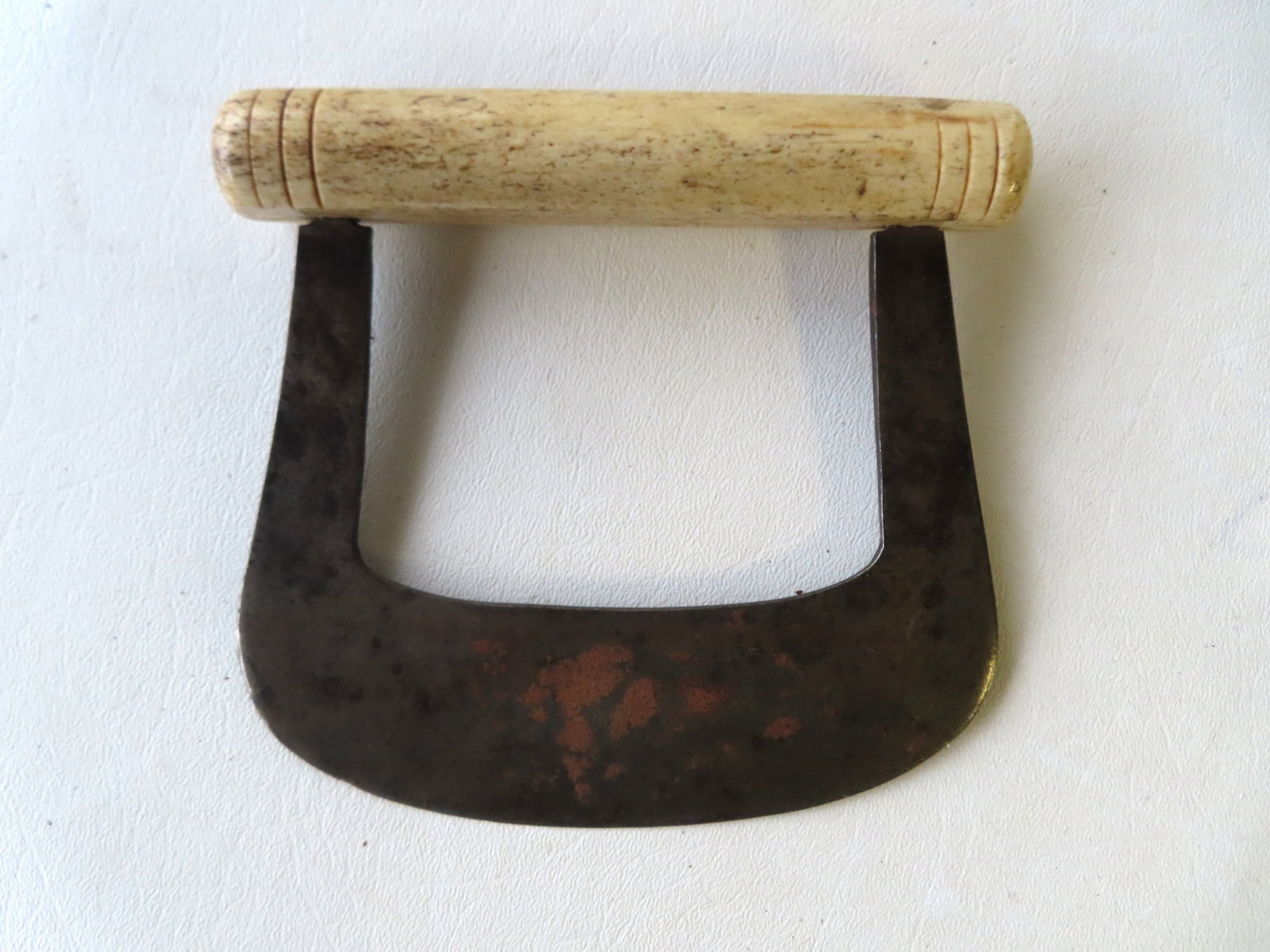 A hand forged iron food chopper with bone handle, mid 19th century or earlier. Very good condition.: A hand forged iron food chopper with bone handle, mid 19th century or earlier. Very good condition. Measures 5 1/2"W x 5 1/4"H.